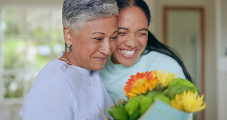 Image showing Happy, mothers day and woman with flowers for surprise, gift and love for family, support and care in home. Wow, thank you and mom with floral, present and person giving parent a bouquet in house