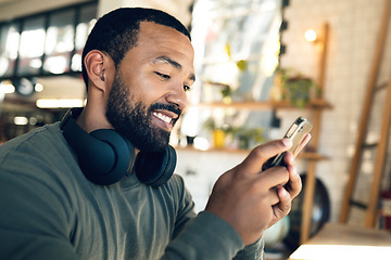 Image showing Man, relax in cafe with smartphone and typing text or email, social media and online communication. Break at coffee shop, mobile app and scroll internet, search engine and chat with smile and tech