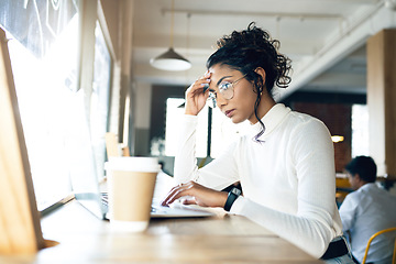 Image showing Woman, laptop and headache in coffee shop for remote work, job search or bad news of startup career, debt or loan. Freelancer person with stress, worry or confused for research on computer at cafe