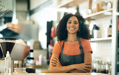 Image showing Happy woman, cafe and portrait of small business owner with arms crossed in confidence at coffee shop. Female person, barista or waitress smile for leadership, management or retail service in store