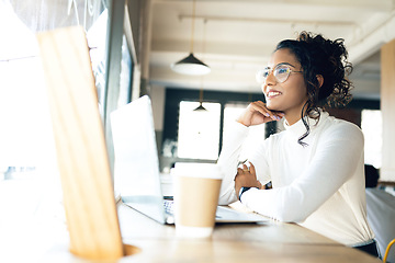 Image showing Laptop, cafe and remote work with a digital marketing woman in a restaurant for research. Computer, small business and a young freelance employee in a coffee shop or restaurant as a startup worker