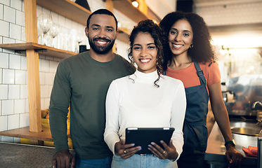 Image showing Barista group, coffee shop and portrait with smile, tablet and together at small business, startup and partnership. Man, women and digital touchscreen in restaurant, cafe and happy with teamwork