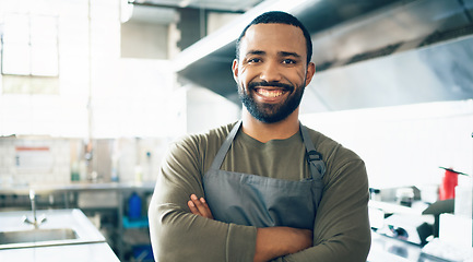 Image showing Happy man, face and small business owner in kitchen at restaurant for hospitality service, cooking or food. Portrait of male person, employee or waiter smile in confidence for professional career