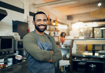 Image showing Happy man, portrait and small business owner in kitchen at restaurant for hospitality service, cooking or food. Face of male person, employee or waiter smile in confidence for professional culinary