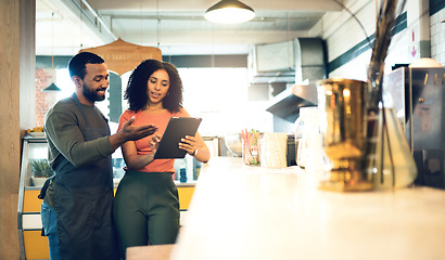 Image showing Coffee shop, teamwork and man with a woman and tablet for online orders, retail information and advice. Happy, ecommerce and a business owner with a waiter and technology reading review on the web