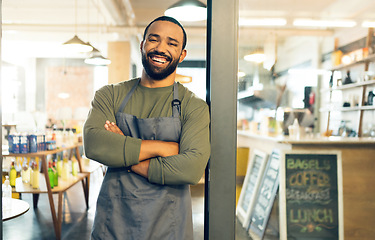 Image showing Happy man, portrait and small business cafe on door with arms crossed in confidence or retail management. Male person, barista or waiter smile by entrance of coffee shop, store or ready for service