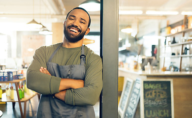 Image showing Happy man, portrait and small business on door with arms crossed, confidence or retail management at cafe. Male person, barista or waiter smile by entrance of coffee shop, store or ready for service