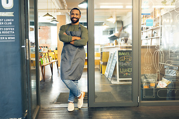 Image showing Happy man, portrait and small business owner on door of cafe with arms crossed in confidence or retail management. Male person, barista or waiter smile by entrance of coffee shop or ready for service