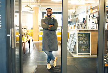 Image showing Happy man, portrait and professional in small business cafe with arms crossed in confidence or retail management. Male person, barista or waiter smile by entrance of coffee shop, store or restaurant