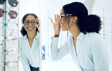 Image showing Optometry shop, mirror or happy woman with glasses, lens frame and shopping for eyewear, vision product or optical support. Reflection, eye care choice and customer smile for prescription eyeglasses