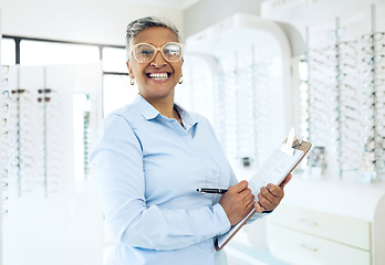 Image showing portrait, optometrist or mature manager with glasses checklist for store inventory or eyewear choice. Woman, product or happy optician in clinic writing on clipboard for eye care in optometry shop