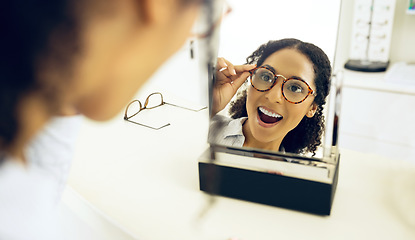 Image showing Optometry store, mirror and woman surprise over eyeglasses decision, optical clinic product or prescription eyewear. Face reflection, ocular eye care and customer shocked, wow and excited for glasses