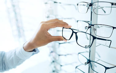 Image showing Optometry store, eyeglasses and hands of person shopping for lens frame decision, retail product or prescription eyewear. Eye care, optical eyesight accessory and closeup customer choice for glasses