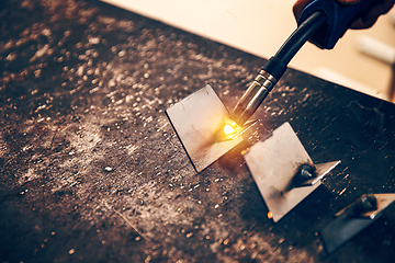 Image showing TIG welder is holding welding torch