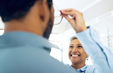 Image showing Optometrist, eye care service or customer with glasses for vision in a retail optical or eyewear shop. Happy woman, choice or man with new spectacles, frame or mature doctor at optics clinic store