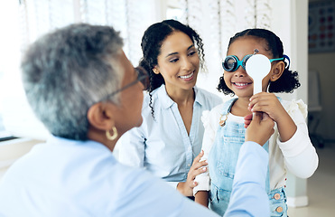 Image showing Eye, test and child with mother at optometrist for eyesight exam, vision and glasses as medical optic health. Care, eyewear and doctor help parent or mom with kid as optometry diagnosis for lenses