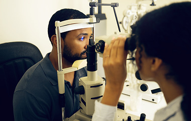 Image showing Man, eye exam and optometry for vision, medical and healthcare consultation with glaucoma check. Client and doctor or expert with laser, blue light or machine for scanning eyes and ophthalmology test