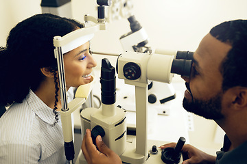 Image showing Eye test, machine and a woman with a doctor for optometry, vision problem and surgery on lens. Happy, clinic and a patient with a man or optometrist for a medical exam, retina health and check