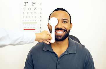 Image showing Man, optometrist and eye test for eyesight, optometry and spoon in portrait, optician and consultation. Vision, exam and specialist for healthcare, medical and clinic for perception, expert or sight