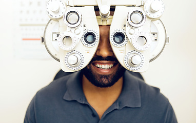 Image showing Eye test, face or happy man consulting to help eyesight at optometrist for a optical assessment. Optometry, wellness or customer in clinic for vision, iris or retina health with machine or phoropter