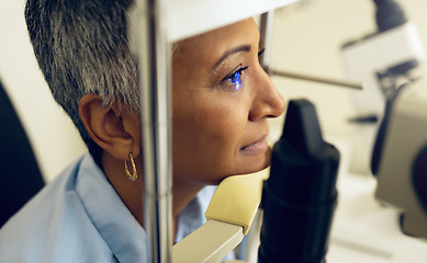 Image showing Eye test, machine and a woman for optometry help, scanning retina or optical surgery at a clinic. Healthcare, ophthalmology and a patient or person with an exam for vision, glasses or lens check