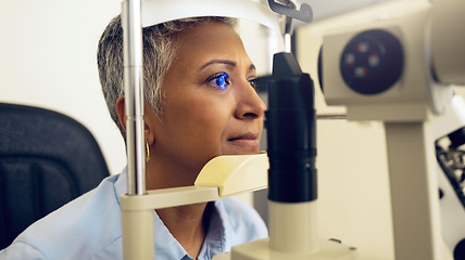 Image showing Eye test, machine and a woman for an optometry problem, scanning retina or surgery at a clinic. Healthcare, ophthalmology and a patient or person with an exam for vision, glasses or lens check