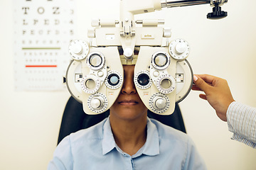 Image showing Woman, eye exam and phoropter with optometrist hand, check and lens for vision, wellness and health in clinic. Doctor, eyesight tools and machine for assessment, consultation and glasses in hospital
