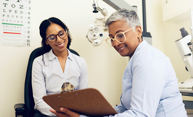 Image showing Optometrist, patient and eye exam, clipboard and health insurance paperwork, help and medical with eyecare. Wellness, contract or agreement with vision, assessment and women in clinic for optometry