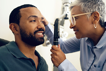 Image showing Patient, eye care and medical ophthalmoscope in clinic to check retina, ocular services and healthcare consultation. Optometrist, glaucoma analysis and testing eyesight of happy man with vision tools