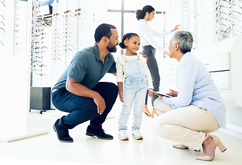 Image showing Optometrist, father and child for eye care, optometry or vision assessment or test in clinic or store. Man, senior woman or girl kid at optician for eyesight appointment for focus or glasses with joy