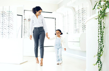 Image showing Eyeglasses store, family holding hands and child shopping for prescription lens, visual product or youth eyewear. Vision wellness, ocular eye care and young kid, mother or customer for glasses sale