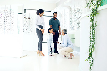 Image showing Optometrist, parents or child for eye care, optometry or vision assessment or test in clinic or store. Man, senior woman or girl kid at optician for eyesight appointment for focus or glasses with joy