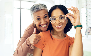Image showing Portrait, senior and women with glasses and thumbs up for vision, wellness or optometry at optometrist. Elderly, face and person with happiness for eyewear, eye care and yes for success or service