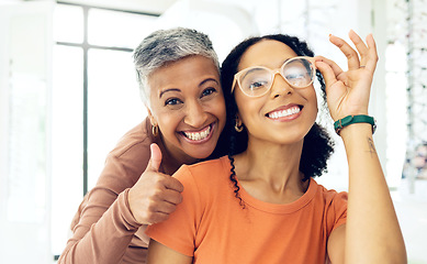 Image showing Optometrist, woman and glasses with thumbs up for medical success, frame choice and happy customer service in store. Professional eye care doctor and client in portrait with like, yes and support