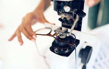 Image showing Lens, glasses or hand with tool for eye care, vision and focus with closeup at optometrist or optometry. Eye care, ophthalmology and healthcare for medical support, eyewear or spectacles to see