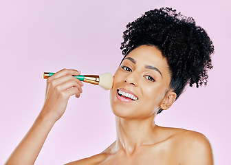 Image showing Portrait, happy woman and brush for makeup in studio for mockup in beauty on pink background. African, female model and smile in confidence for powder, foundation or cosmetic for results in coverage