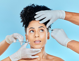 Image showing Skincare, needle and filler, woman with hands on face in studio at plastic surgery consultation. Model with facial, aesthetic and salon for beauty, dermatology or collagen therapy on blue background