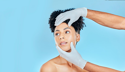 Image showing Skincare, plastic surgery and woman with hands on face in studio at cosmetic consultation. Model with spa, facial and filler for beauty, dermatology or collagen therapy on blue background mockup.