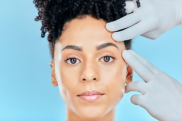 Image showing Change, plastic surgery and portrait of woman with hands on face in studio for cosmetic facial consultation. Skincare, dermatology and professional collagen therapy, beauty model on blue background.