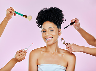 Image showing Hands, portrait and a woman with makeup, tools and help on a pink background. Happy, skincare and a model or girl with people for cosmetics work, glow and facial beauty with a smile and artists