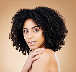 Image showing Woman, face and beauty, hair and natural curls, salon treatment and shine, healthy skin glow on studio background. Skincare, dermatology and clean makeup, haircare and texture with afro in portrait