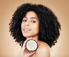 Image showing Studio woman, beauty portrait and coconut skin detox, vegan nutrients or organic facial cosmetics, antioxidants or self care. Clean face, fruit benefits and model skincare product on brown background