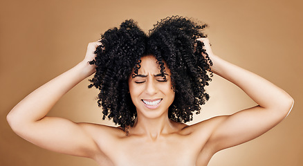 Image showing Woman afro, studio hair problem and grooming care mistake, shampoo allergic reaction or texture crisis, risk or fail. Spa salon hairstyle, keratin and face of person stress on brown background