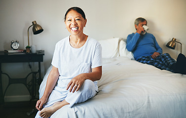 Image showing Portrait, smile and a senior asian woman on her bed in her retirement with her husband drinking coffee. Relax, bedroom and a happy elderly person in her home or hotel room for hospitality together