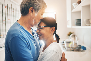 Image showing Hug, smile and mature couple kiss in home for care, support or trust together. Embrace, happy man and woman in kitchen for connection, romance or healthy relationship for love, commitment or marriage