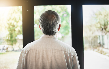 Image showing Back, mature man and thinking by window, depression and anxiety alone in home. Rear view, retirement and sad person contemplating in house, planning future and remember memory, idea or reflection