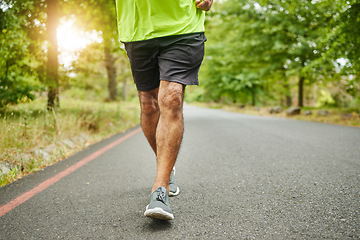 Image showing Running, workout or legs of man on road, nature or forest for trekking journey or adventure for freedom. Shoes closeup, footwear or runner on street in park or woods for exercise, fitness or wellness