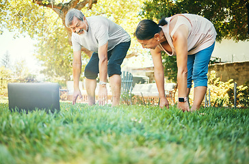 Image showing Yoga, stretching and mature couple on laptop outdoor for exercise, flexible and body health. Pilates, smile and Asian man and woman at park on computer for online class, fitness or wellness together