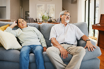 Image showing Senior couple, angry and sofa in home living room, thinking or frustrated face for conflict in retirement. Elderly Asian man, old woman and stress on couch with silence, argument or fight in house