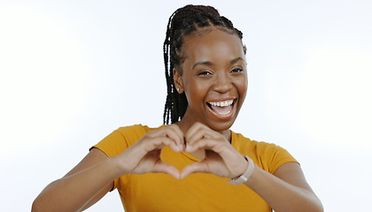 Image showing Woman, studio portrait and hands with heart emoji for love, support and positive sign by white background in close up. Black person, smile and hand gesture for care with kindness, trust and hope